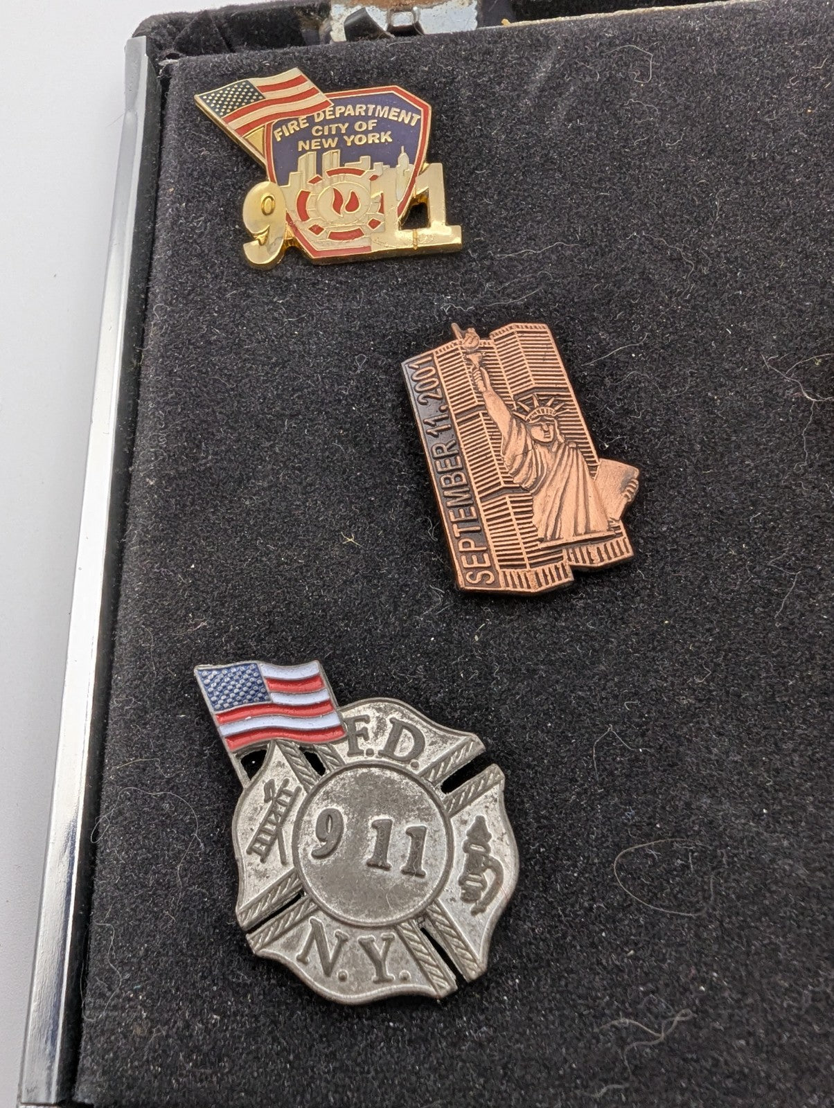 Collection of September 11, 2001 commemorative lapel pins (8)