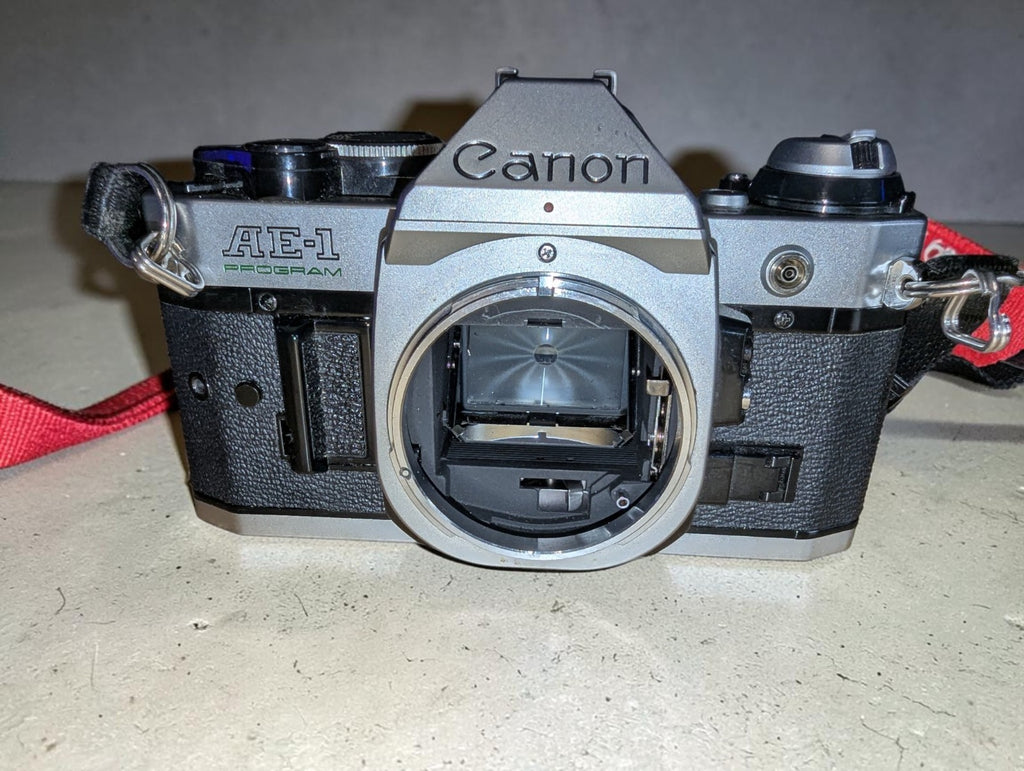 Vintage Canon AE-1 Program with FD 100mm Focus Lens and Speedlite 155A