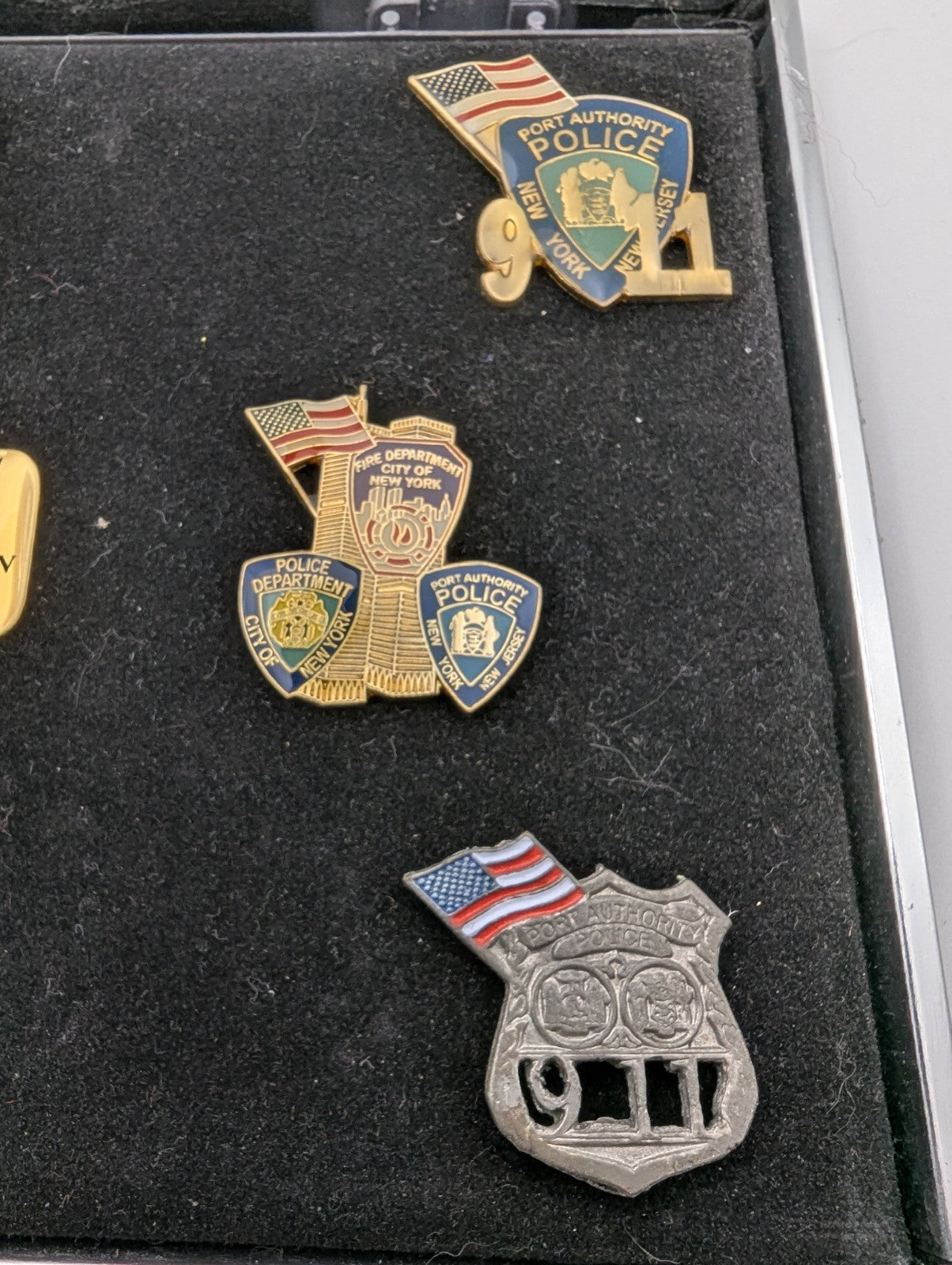 Collection of September 11, 2001 commemorative lapel pins (8)