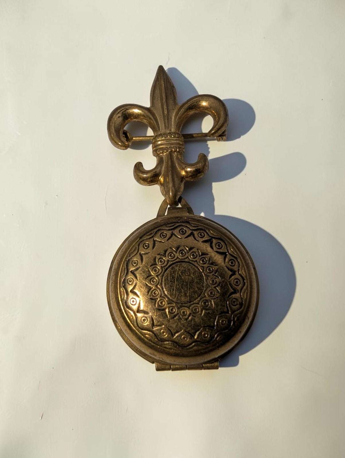 1940s  Brass Fleur-de-lis Round Locket Brooch