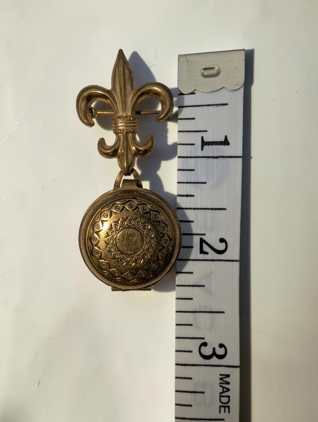1940s  Brass Fleur-de-lis Round Locket Brooch