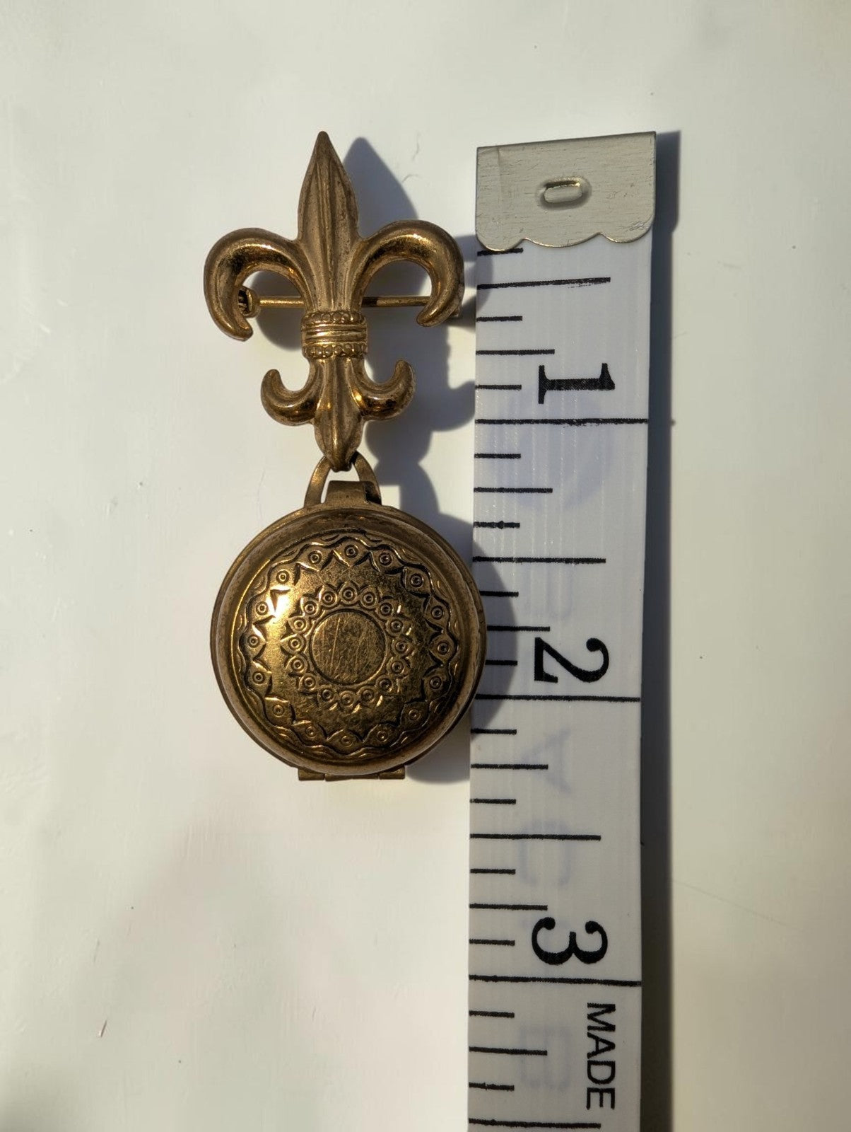 1940s  Brass Fleur-de-lis Round Locket Brooch