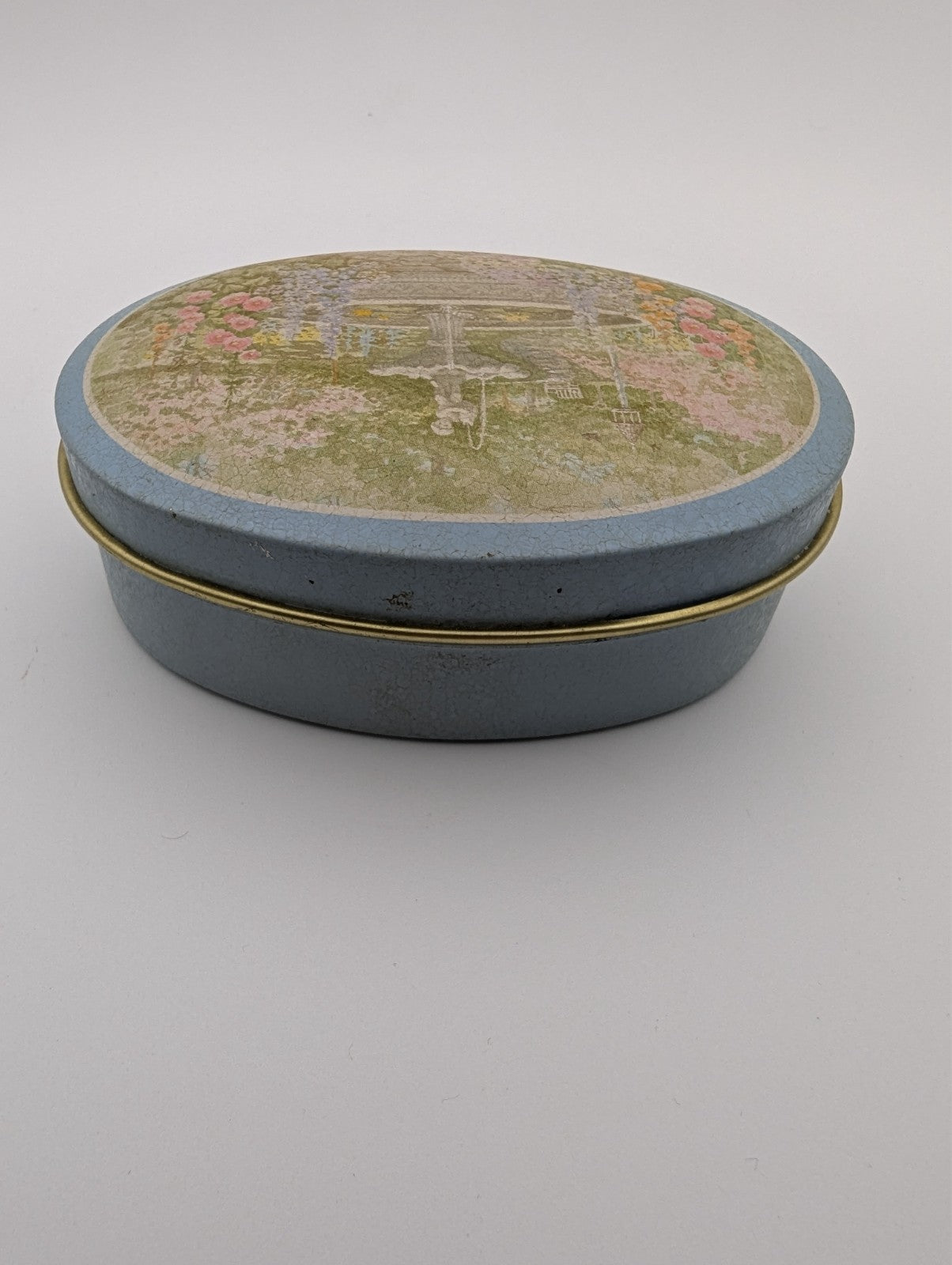 Vintage Oval Decorative Tin, Fountain and Flower, 3.5"x2"