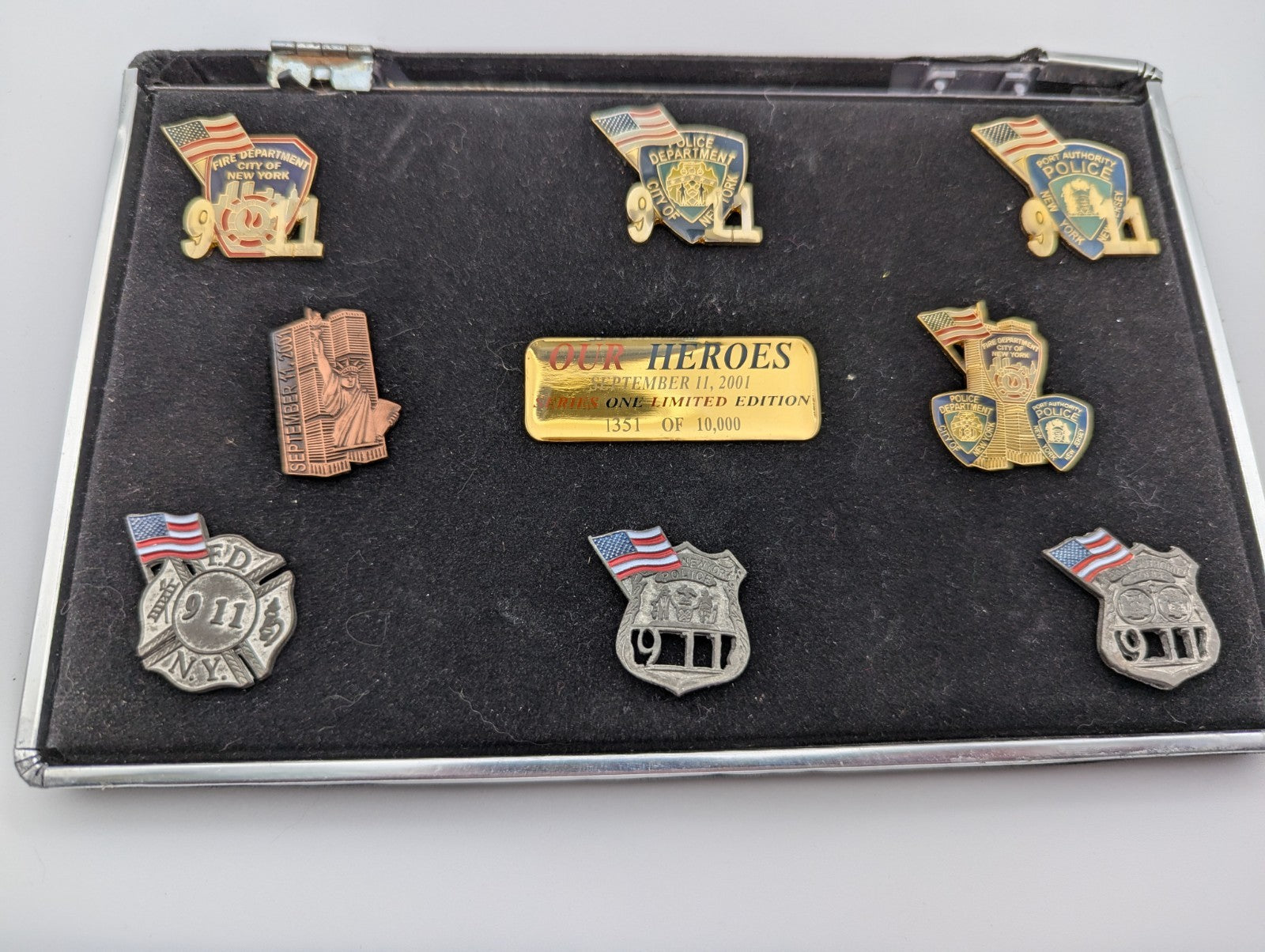 Collection of September 11, 2001 commemorative lapel pins (8)